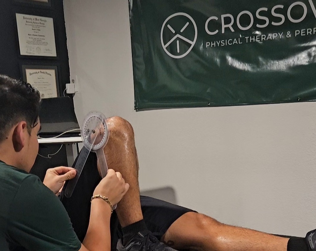 Tampa runner receiving 1-on-1 running physical therapy assessment from Dr. Bryant Villota at Crossover Physical Therapy & Performance